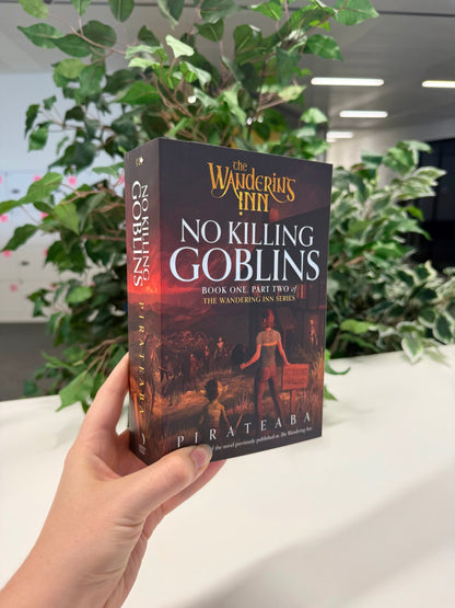 No Killing Goblins paperback held at an angle, showing the front cover and spine