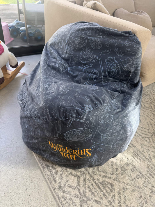 Bean bag chair with 'The Wandering Inn' design on a carpeted floor.