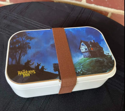 The Wandering Inn bento lunch box closed, showing the full illustrated lid artwork
